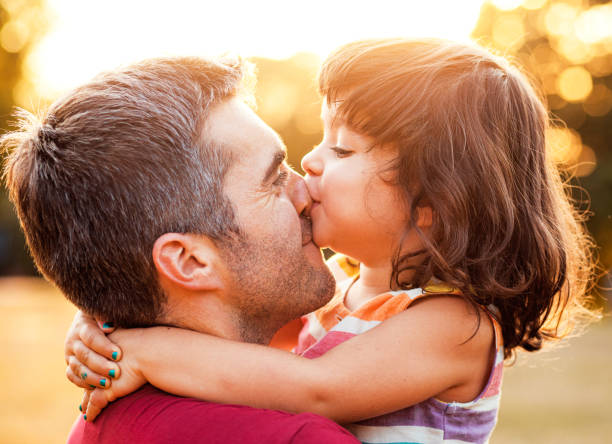 istock Happy father playing with his daughter in park. 1192328618