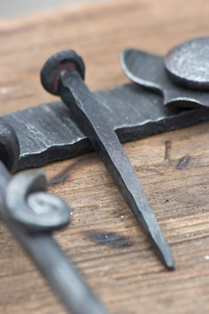 istock Forged old fashioned iron nail. 1192330938