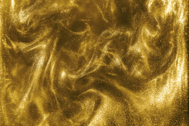 istock gold glitter shimmering magic bokeh background 1192332486