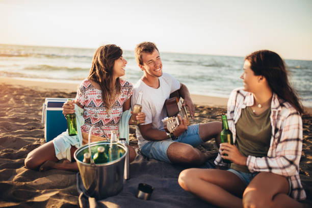 istock Friends having fun at the beach on a sunny day. 1192335841