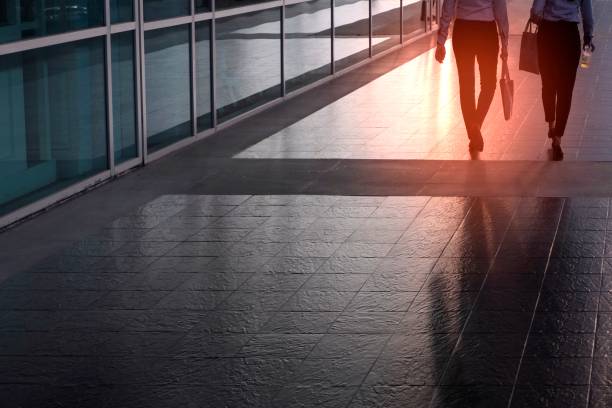 istock female officer walking on sidewalk 1192336096