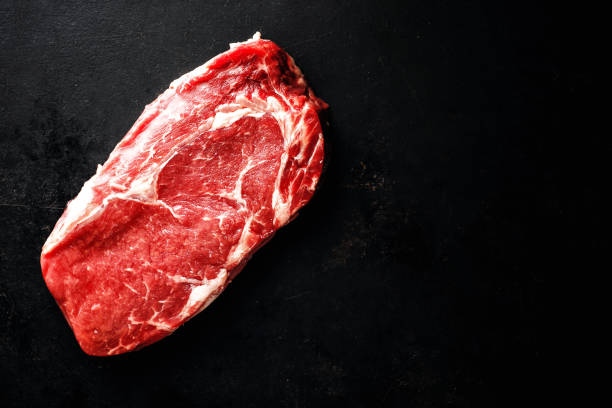 istock Raw meat steaks with ingredients 1192340495