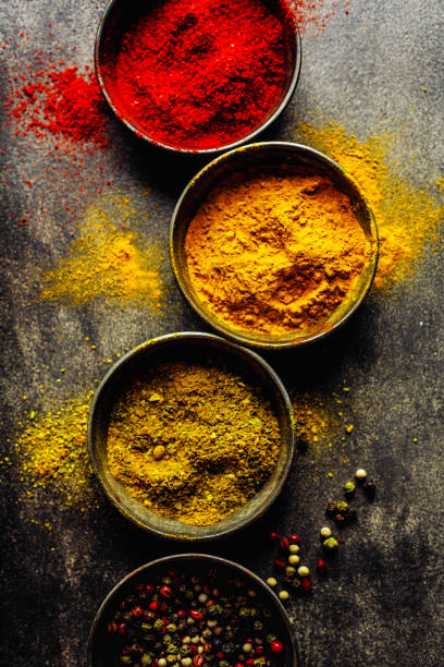 istock Colorful spices on dark background 1192341108
