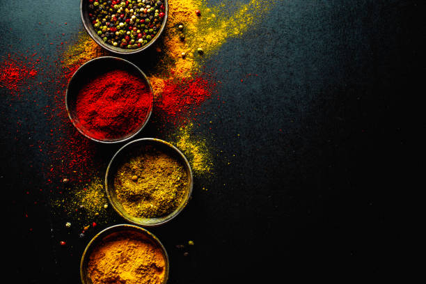 istock Colorful spices on dark background 1192341266