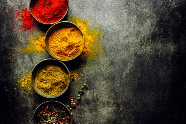 istock Colorful spices on dark background 1192341539