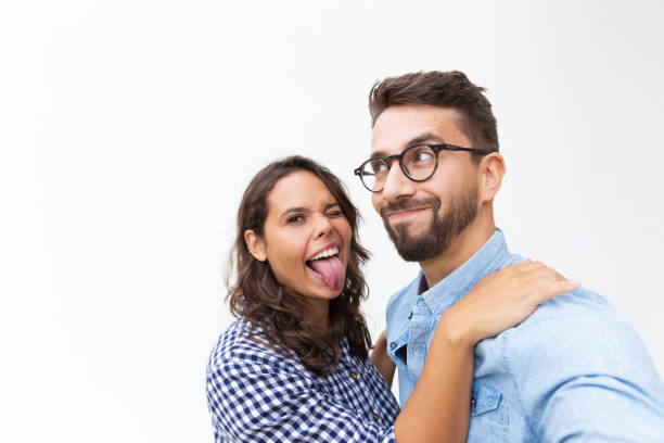 istock Joyful funny couple grimacing for selfie 1192342643