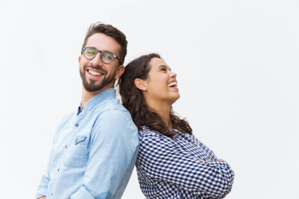 istock Joyful carefree couple leaning on each other 1192342721