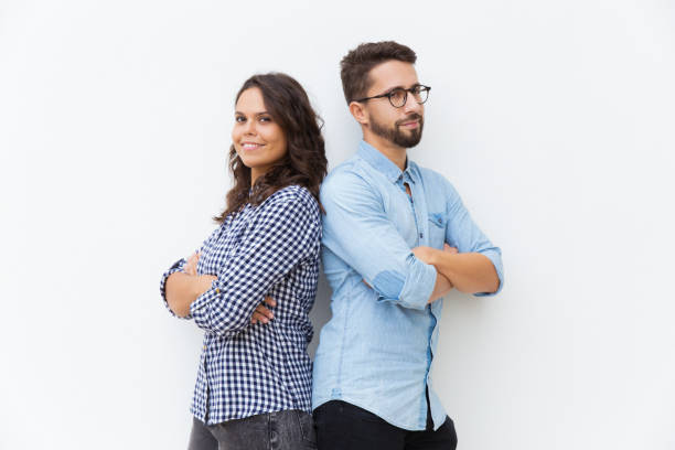 istock Happy friendly couple standing back-to-back 1192342799