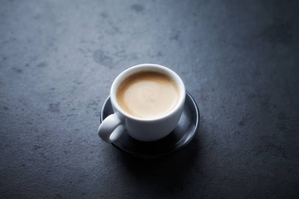 istock Cup of coffee on black background. Copy space. 1192343839