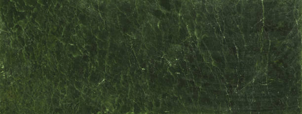 istock nephritis,jade, abstract dark green gemstone background 1192345529