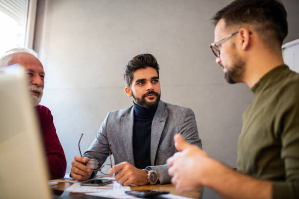 istock Three businessmen on a meeting in office. 1192346181