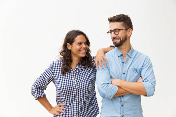 istock Cheerful couple standing close together 1192346228