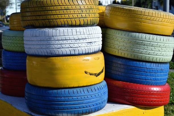 istock Brightly painted used tires 1192346260