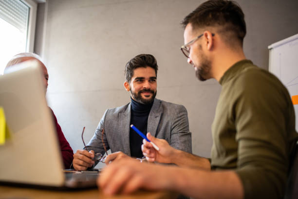 istock Three entrepreneurs on a business meeting. 1192346474