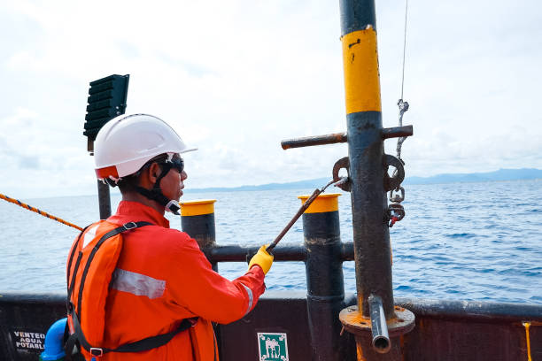 istock Sailor doing repairs on industrial ship 1192346972