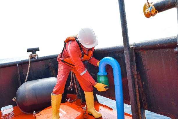 istock Sailor doing repairs on industrial ship 1192347041