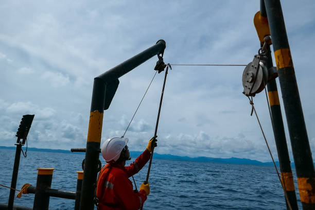 istock Sailor doing repairs on industrial ship 1192348115