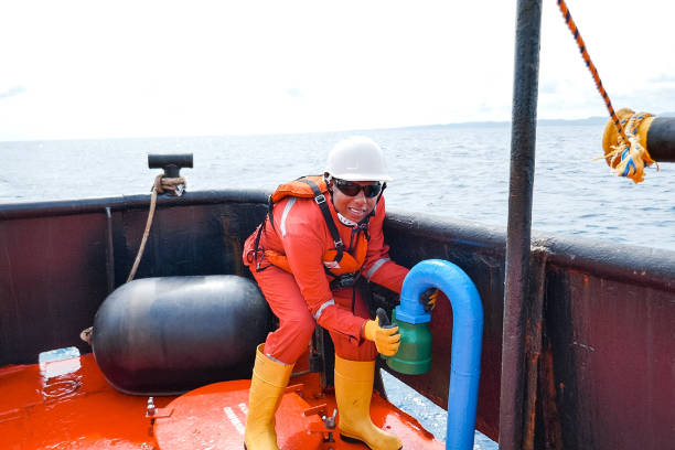 istock Sailor doing repairs on industrial ship 1192348116