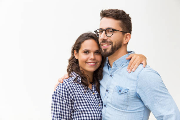 istock Positive beautiful couple hugging and looking at camera 1192349302