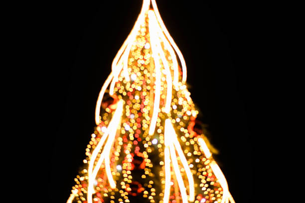 istock Blurred christmas tree background with orange lights. 1192351162