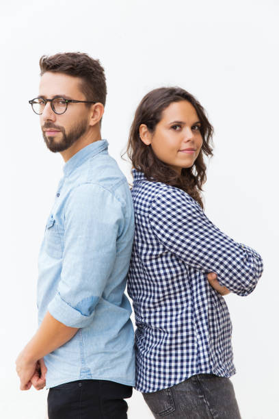 istock Serious pensive couple standing back-to-back 1192351690