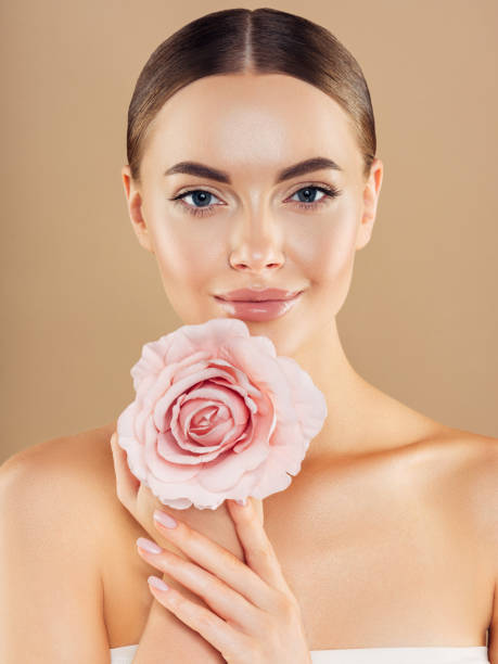 istock Beautiful woman with rose. Natural soft make-up. 1192351719