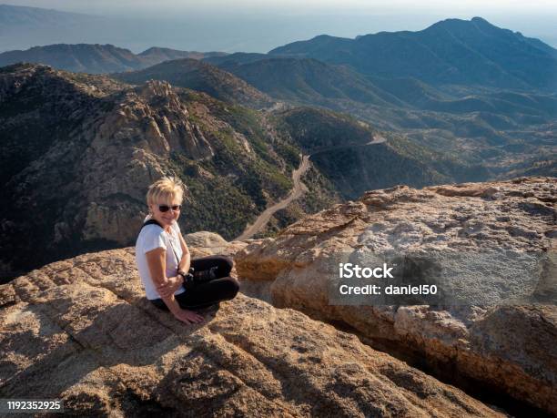 Women Sitting On Mountain In Mt Lemmon Stock Photo - Download Image Now - Arizona, Hiking, 55-59 Years