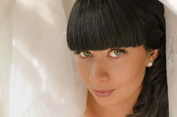 bride in white, portrait of a brunette woman.