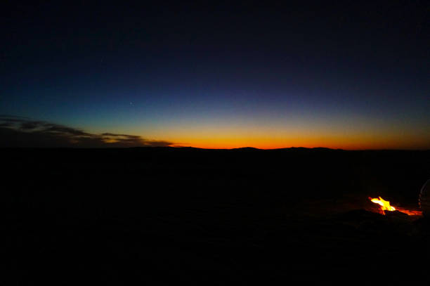 istock Sunset in the desert and Fire 1192354239