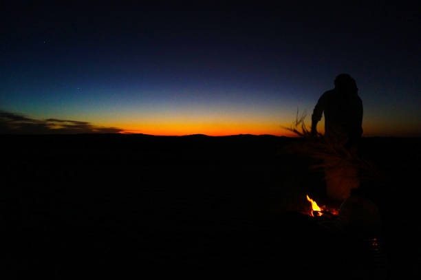 istock Sunset in the desert and Fire 1192355415