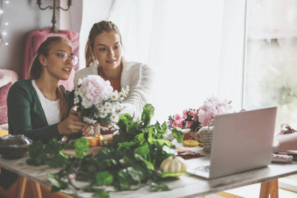 istock Looking up ideas for flower arrangements on laptop 1192355494