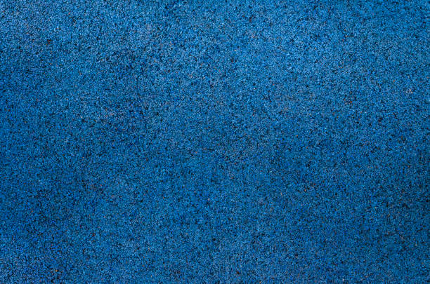 blue little pebbles. The background consists of small blue pebbles. With many possible uses. The texture is made up of tiny blue pebbles. close-up
