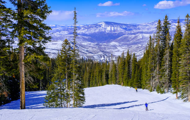 istock Colorado ski slope with beautiful mountain peak in background 1192361884