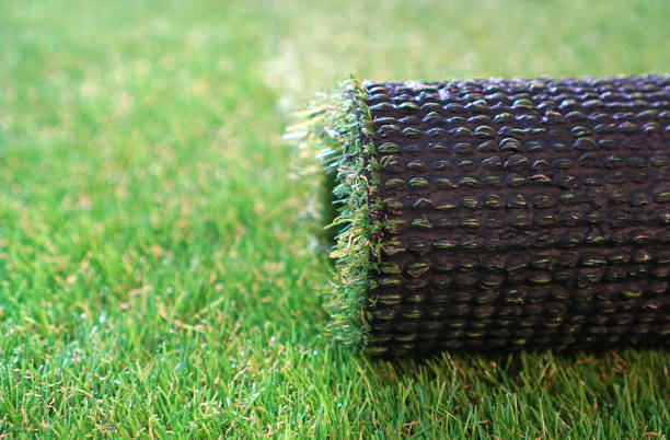 istock Roll of an artificial grass. Landscape greenering with artificial turf. 1192362563