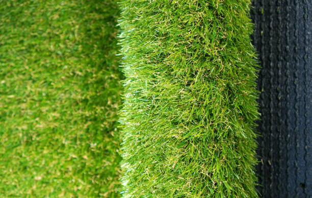 istock Roll of soft artificial grass. Luxury artificial turf background. 1192362585