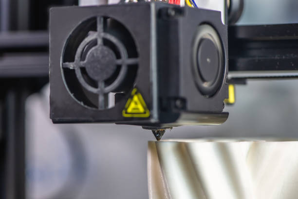 istock The 3D printer prints the model out of white plastic. 1192362668