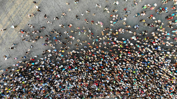 Aerial. Hundreds of people. Crowd of people top view from drone. Aerial. Hundreds of people. Crowd of people top view from drone. population explosion photos stock pictures, royalty-free photos & images