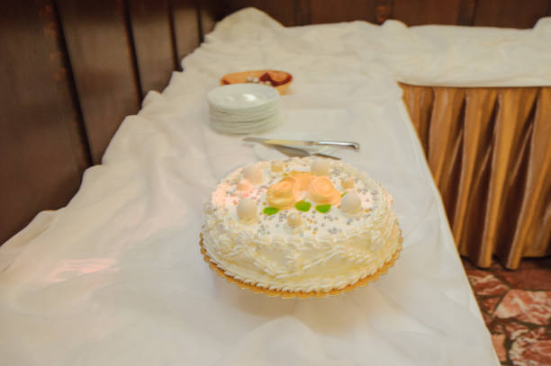 istock Delicious Wedding Cake at the party. Smoke and fire effects. 1192363634