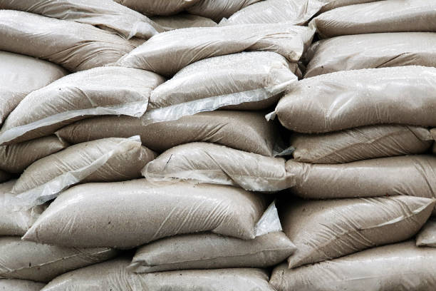 Many canvas bags stacked in a pile