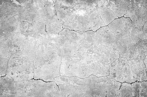 Gray stone cracked old grunge wall texture background