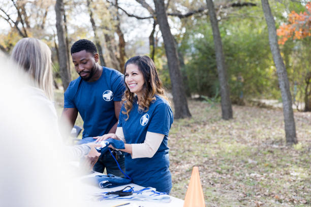 istock Couple work registration table during volunteer event 1192366448