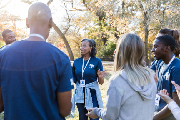 istock Confident volunteer coordinator instructs volunteers 1192366466