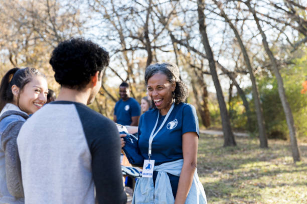 istock Volunteers talking during community cleanup event 1192366470