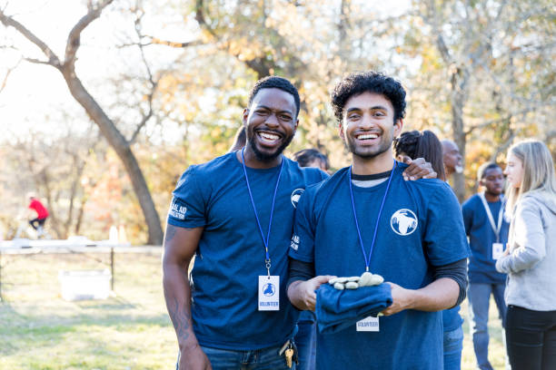 istock Male friends volunteer during cleanup event 1192366476
