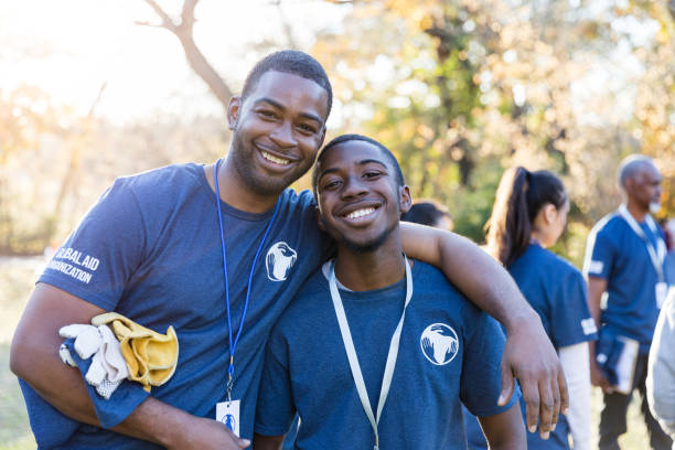 istock Happy father and son volunteer during cleanup event 1192366480