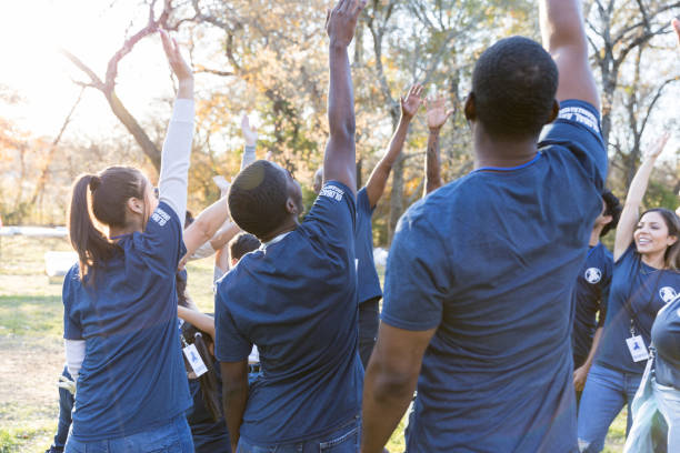 istock Group of cheering volunteers 1192366485