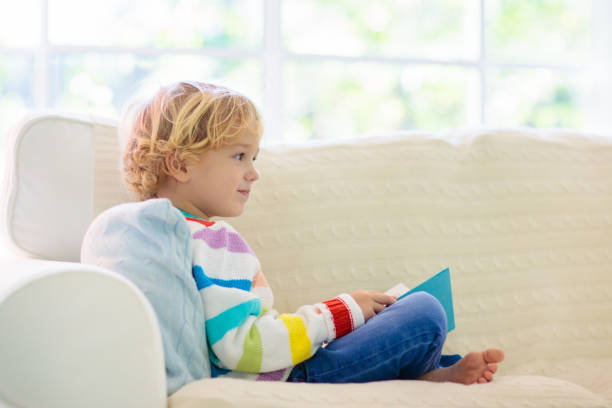 istock Child reading book. Kids read books. 1192366611