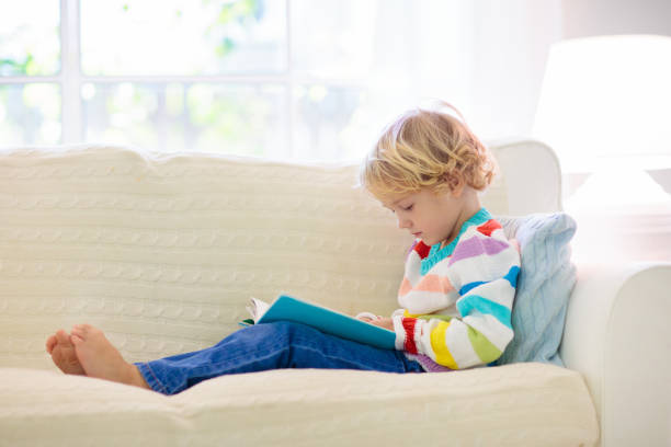 istock Child reading book. Kids read books. 1192368350
