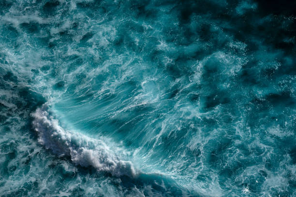 istock Aerial view to ocean waves. Blue water background 1192370997