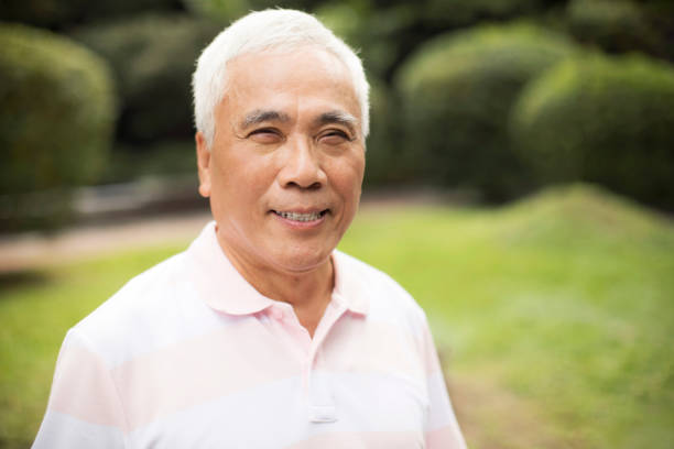 istock Senior Asian man smiling at the camera 1192376079